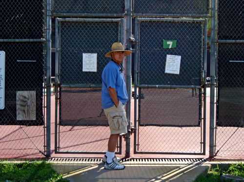 Tennis trainer outside SBCC tennis courts