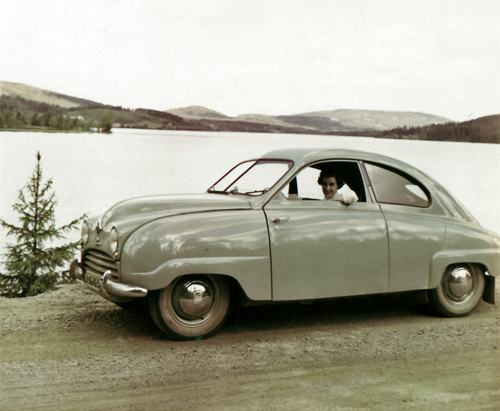 Mom is sitting behind the steering-wheel in dad’s Saab from 1949