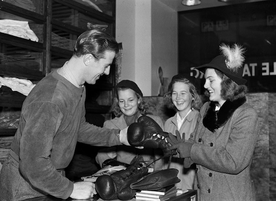 Boxing champion Olle Tandberg sells sports equipment in his store in Stockholm